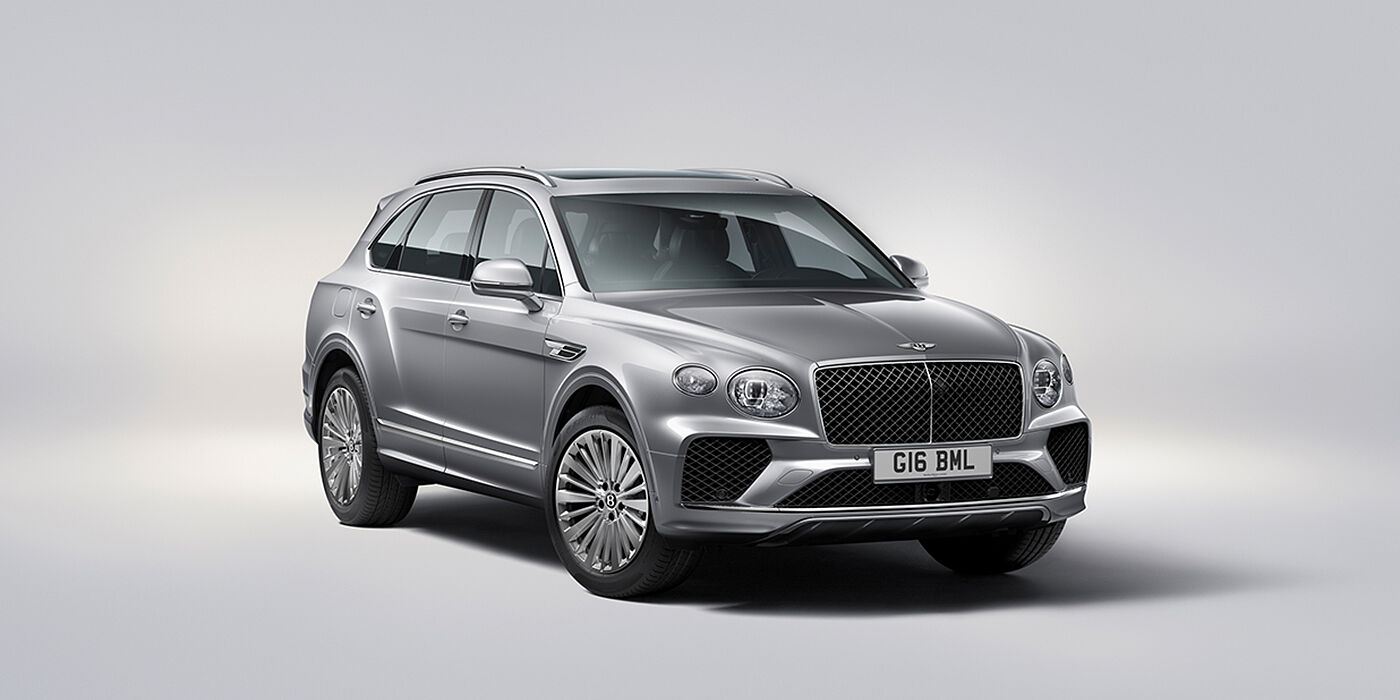Bentley Luxembourg Bentley Bentayga luxury SUV front three quarter view in Moonbeam paint with matrix grille and 21″ 5 spoke painted wheels