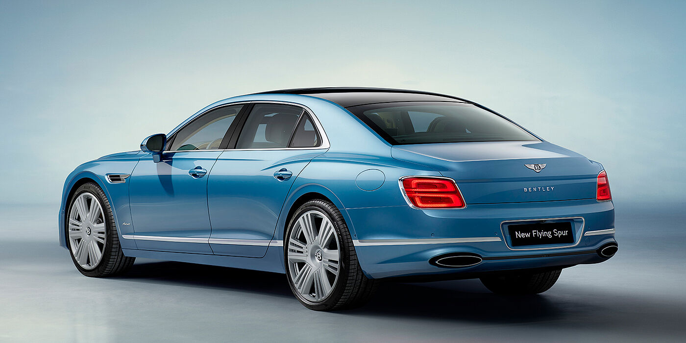 Bentley Luxembourg New Bentley Flying Spur Azure sedan rear view in Light windsor blue by Mulliner paint with 22 inch Azure wheels and chrome exterior details