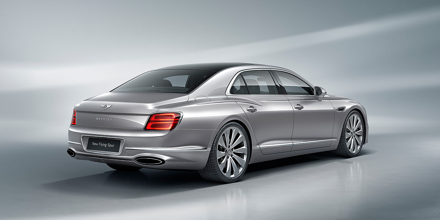 Bentley Luxembourg New Bentley Flying Spur sedan rear view in Silverlake paint with ten spoke wheels and chrome matrix grille