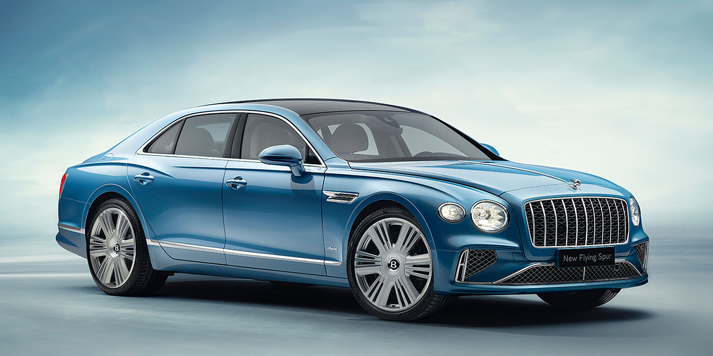 Bentley Luxembourg New Bentley Flying Spur Azure sedan front view in Light windsor blue by Mulliner paint with 22 inch Azure wheels and chrome exterior details