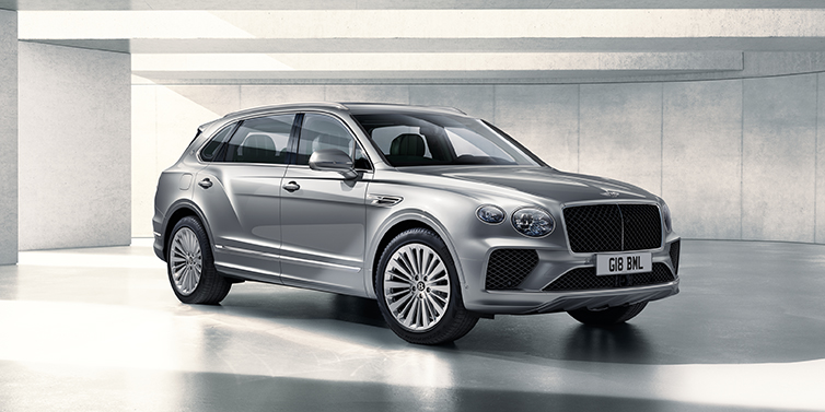 Bentley Luxembourg Bentley Bentayga Extended Wheelbase SUV front three quarter in Moonbeam paint with a grey background