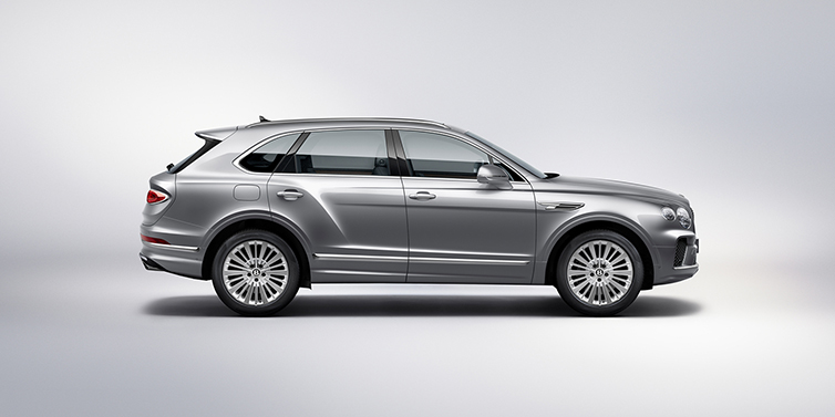 Bentley Luxembourg Bentley Bentayga SUV side profile in Moonbeam silver paint against white background featuring 21 inch 5 spoke wheels